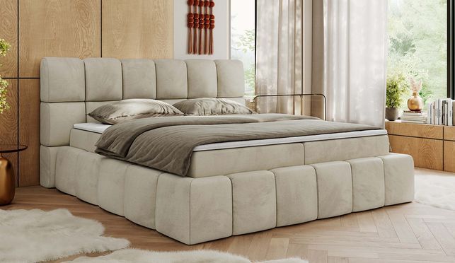 Ein modernes Boxspringbett mit weicher Oberfläche und auffälligem Design